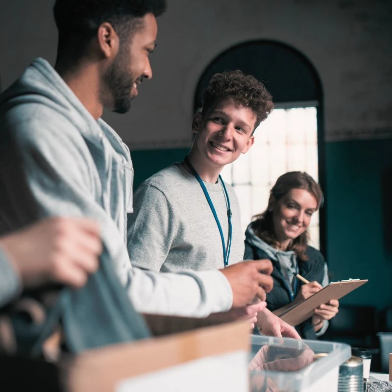 People working together on a community project indoors
